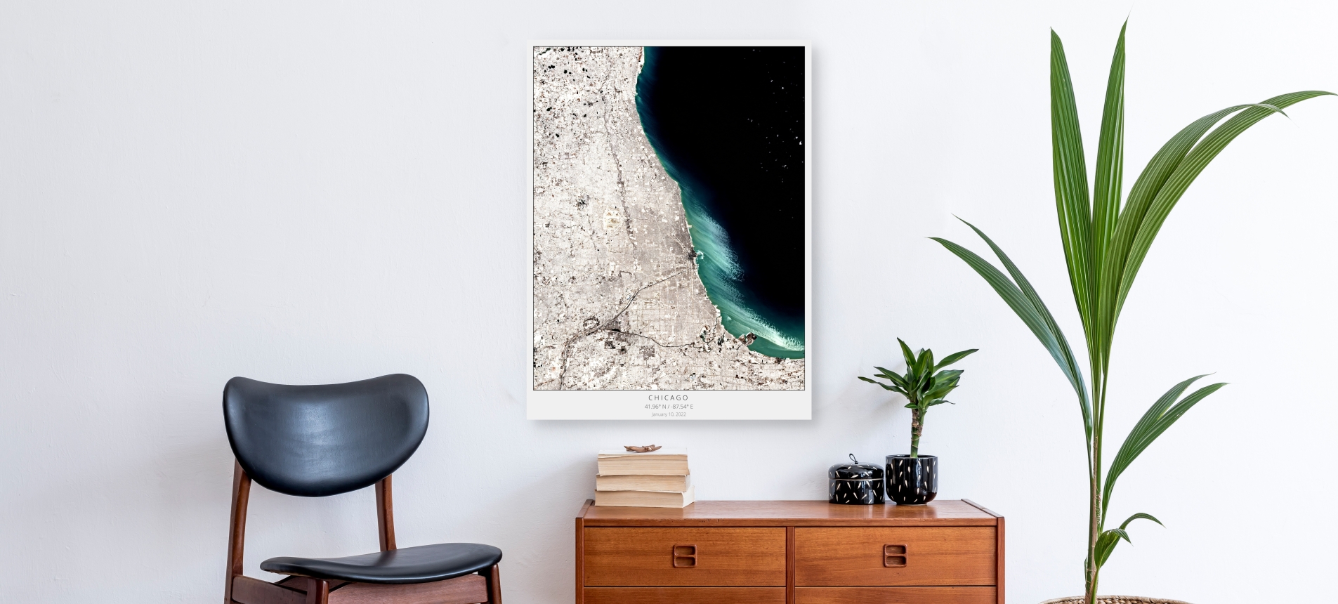 Photo of a living room with a poster of a satellite image of Chicago in winter on the wall